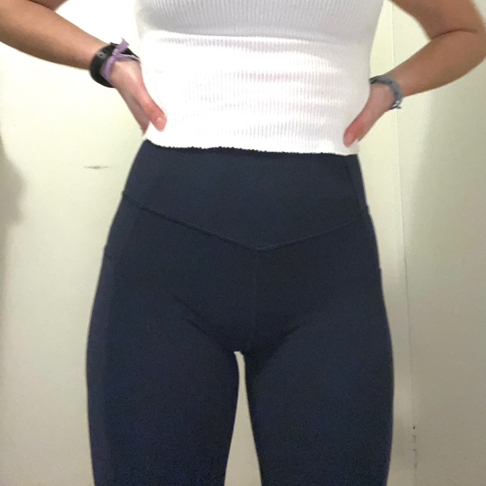 Athleta “Salutation Stash Pocket II 7/8 Tight”